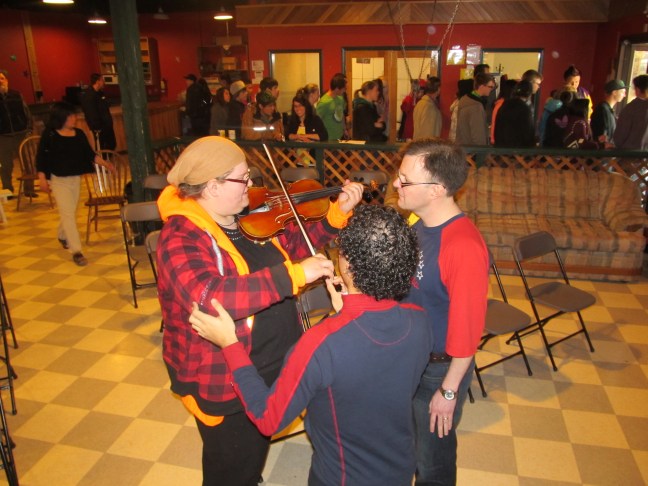 Samuel gives an impromptu violin lesson